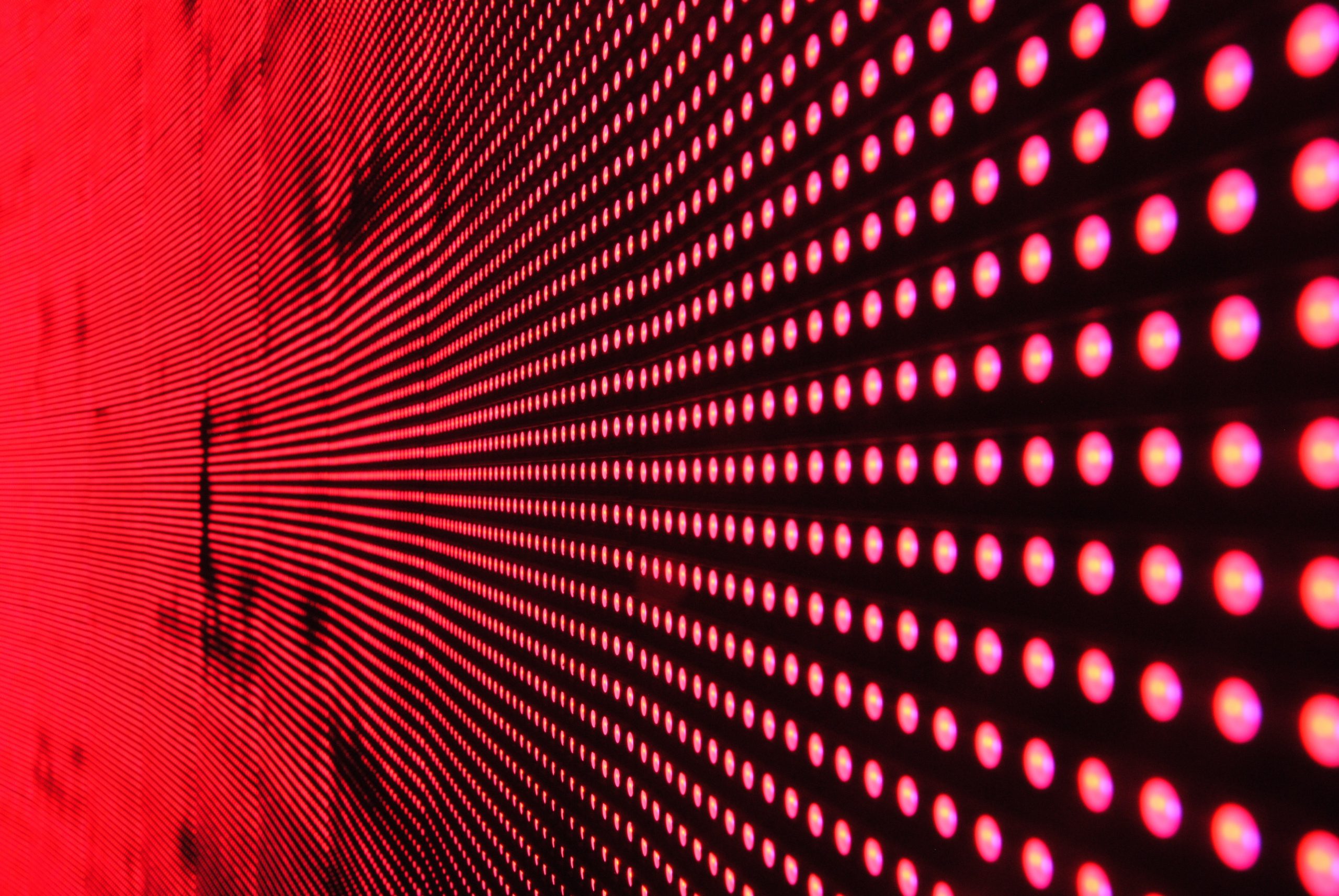 red-lights-in-line-on-black-surface-158826-scaled